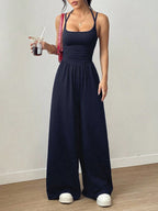 Women’s casual summer jumpsuit with wide-leg design, nipped waist, and wrapped chest, by Plush Fashion Hub.