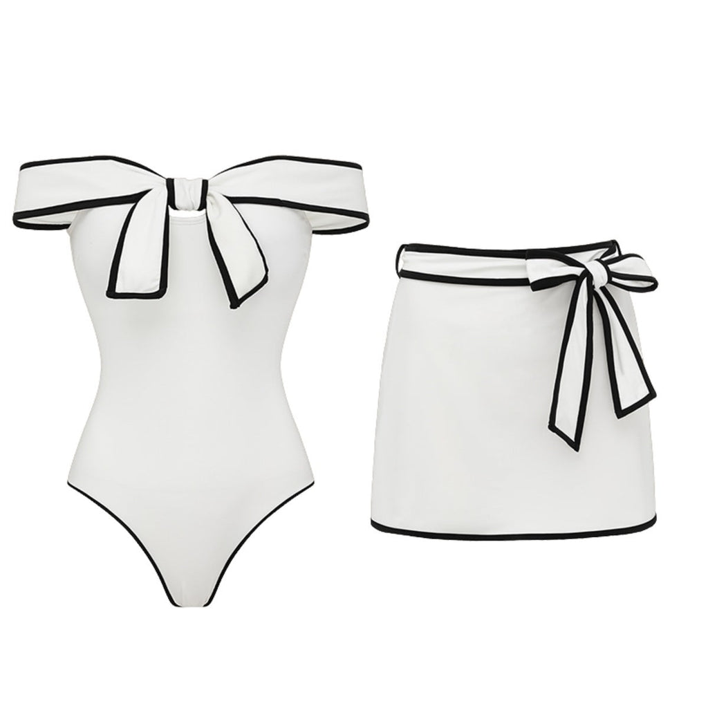 Black and white swimsuit for women with a sweet girl bow and matching skirt, featuring color-coordinated design by Plush Fashion Hub.
