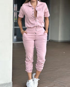 Casual women's ankle-tied jumpsuit with collar, pockets, elastic waist, and button details, by Wanita Store.