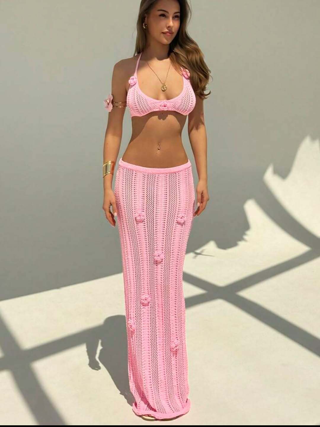 Floral knitted bikini swimsuit with halter straps, cropped design, and floating floral pattern, by Plush Fashion Hub.