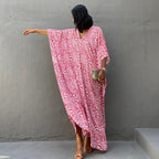 Printed long beach cover-up skirt by Plush Fashion Hub, featuring sun protection and flowy maxi dress style for vacation wear.