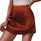 Bella Mia satin mini A-line skirt with pleats, high waist, and elegant design for women.