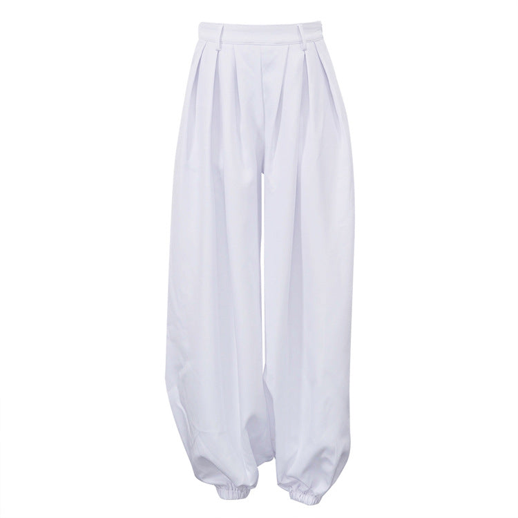 Women’s white high-waist tapered trousers with pleats, loose fit, and casual style from Wanita Store featuring all-match design.