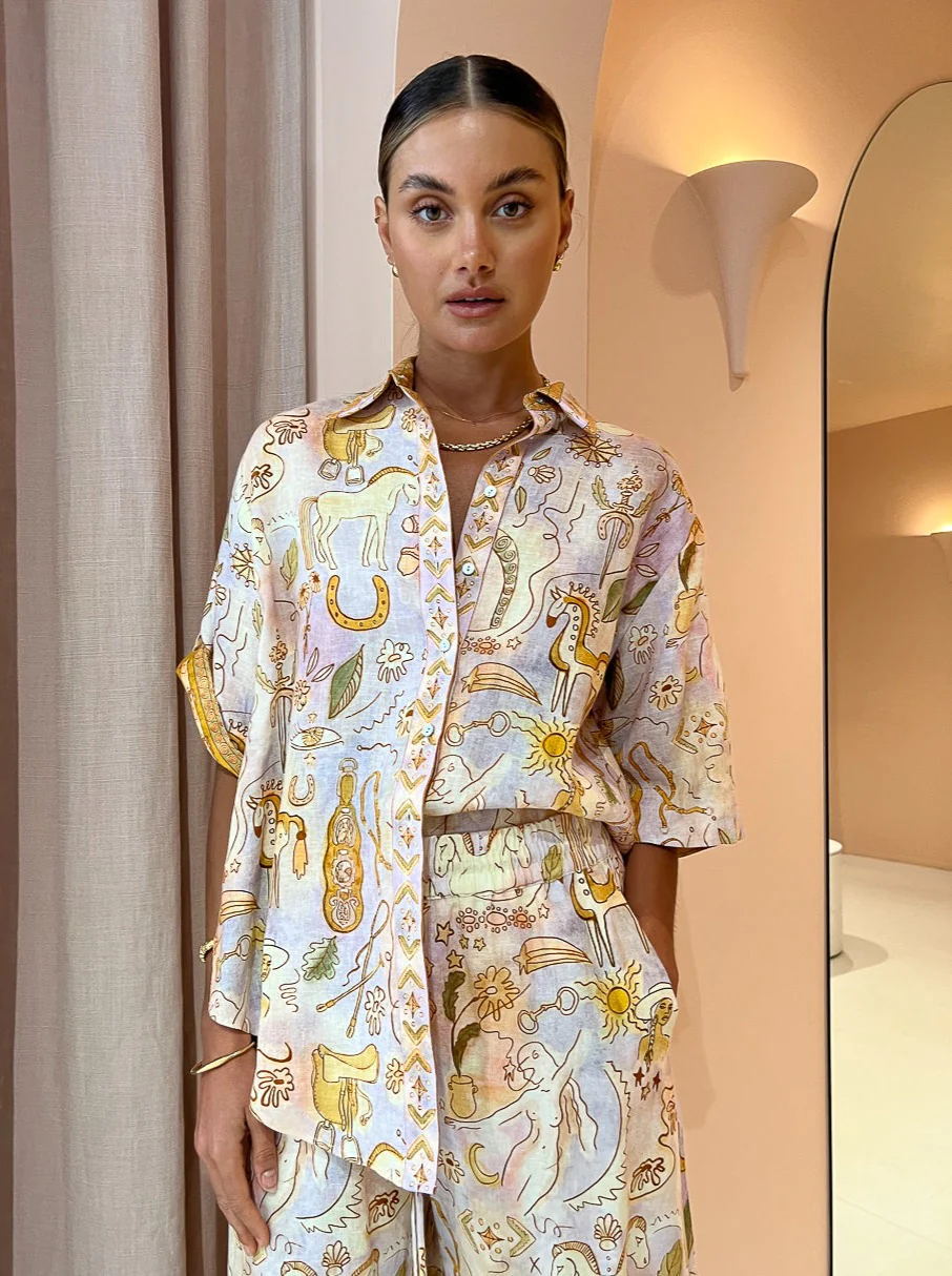 Casual women's two-piece spring summer suit with pocketed half sleeves and loose fit, suitable for everyday wear.