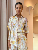 Casual women's two-piece spring summer suit with pocketed half sleeves and loose fit, suitable for everyday wear.