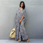 Printed long beach cover-up skirt by Plush Fashion Hub, featuring a maxi dress style with sun protection and stylish blouse design.