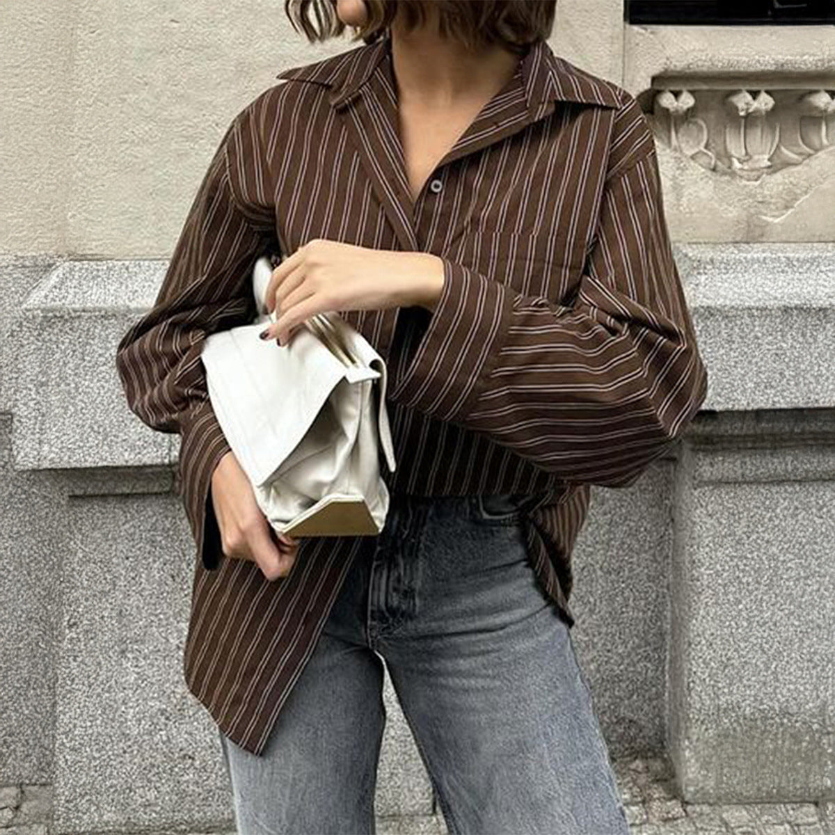 Women’s plaid long sleeve coat shirt by Plush Fashion Hub, perfect for autumn casual vacation style, shown in natural fabric detail.