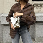 Women’s plaid long sleeve coat shirt from Wanita Store, perfect for autumn casual vacation outfits, shown in a stylish relaxed fit.