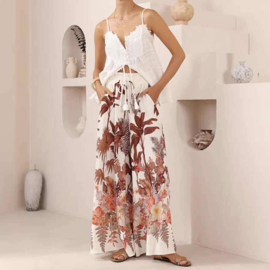 Casual summer wide-leg pants with a green leaf print, loose fit, made by Plush Fashion Hub.