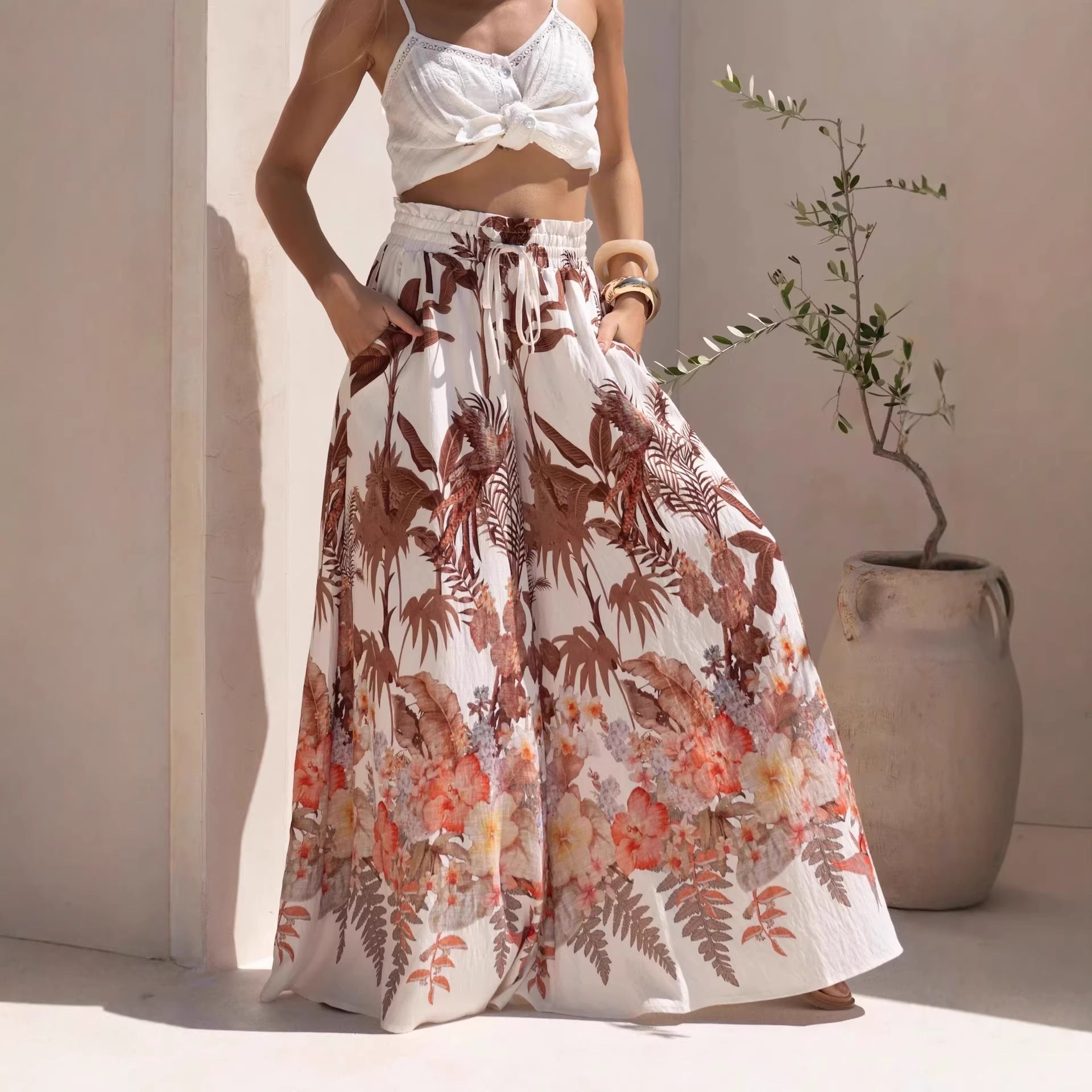Leaf print summer wide-leg pants from Wanita Store featuring casual, loose-fitting design and comfortable wide leg style.