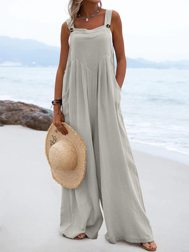 Women’s summer jumpsuit by Bella Mia featuring ethnic solid color fabric and wide-leg style, displayed on a model.