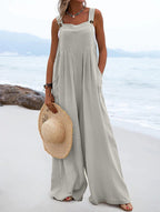 Women’s summer jumpsuit by Bella Mia featuring ethnic solid color fabric and wide-leg style, displayed on a model.