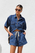 Casual summer women's clothing set by Wanita Store featuring a loose short-sleeved denim shirt with pockets and matching shorts.