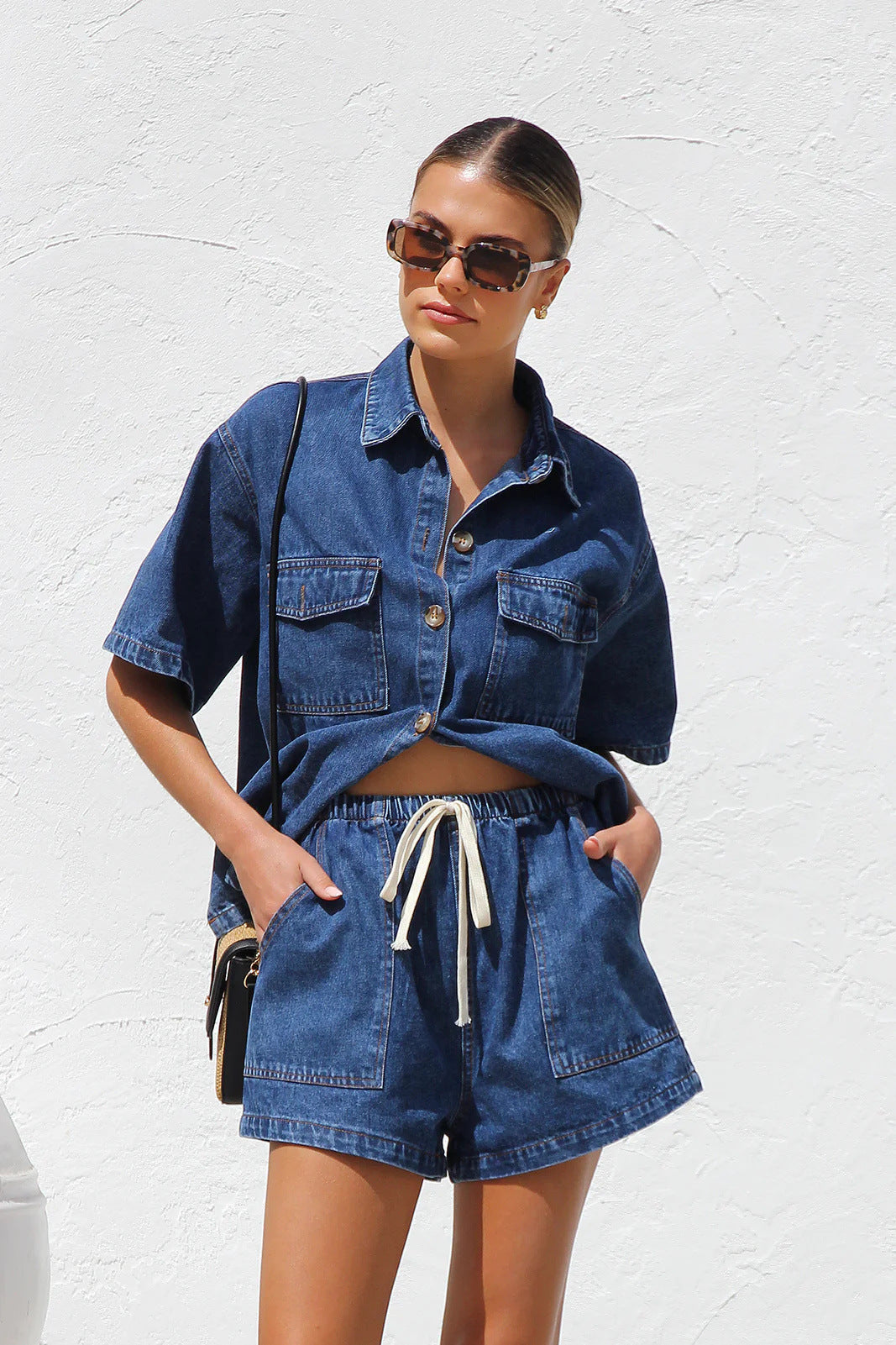 Women's casual loose denim two-piece set with pockets and short sleeves, by Plush Fashion Hub, featuring relaxed denim tops.