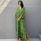 Printed long beach cover-up skirt from Plush Fashion Hub, featuring a maxi dress style with sun protection and swimsuit-friendly design.