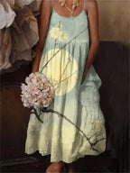 European and American style floral art print sling holiday dress from Plush Fashion Hub, showcasing colorful floral patterns.