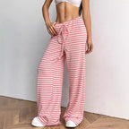Women’s casual striped straight-leg pants with rubber band waist and drawstring, in solid color for autumn and winter wear.