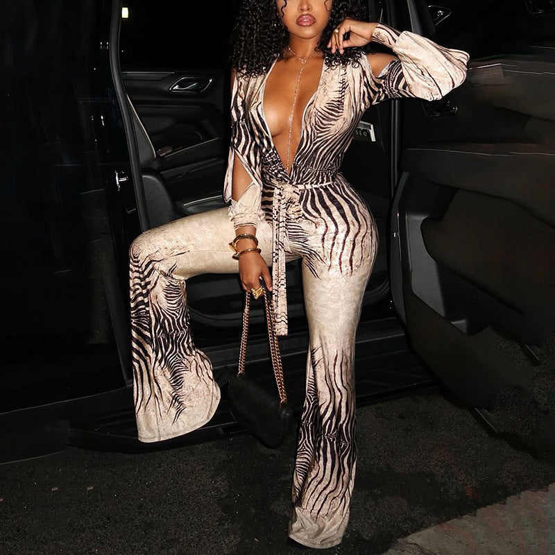 Deep V plunge off-shoulder top and high waist bootcut pants jumpsuit by Plush Fashion Hub, shown in stylish black fabric.