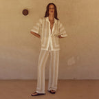 Solid color knitted bikini swimsuit and blouse set for women, featuring a two-piece beachwear by Bella Mia, displayed on a model.