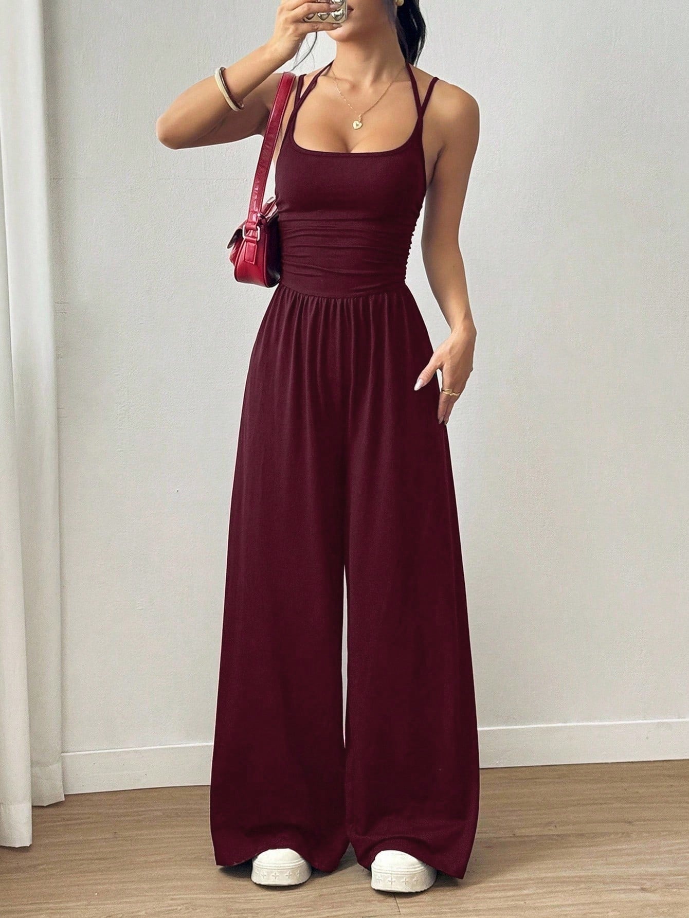 Women’s casual summer jumpsuit with wide legs, wrapped chest, nipped waist, and suspenders by Plush Fashion Hub.