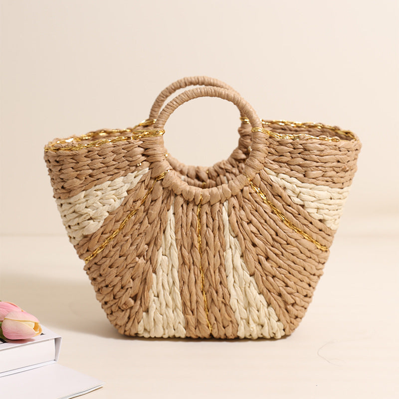 Bella Mia large straw-weaved bag with contrast color handles, perfect for beach, vacation, or vegetable shopping.