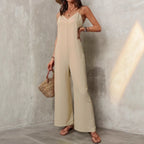 Women’s sleeveless sling jumpsuit with wide-leg pants in solid color, casual and loose fit by Plush Fashion Hub.