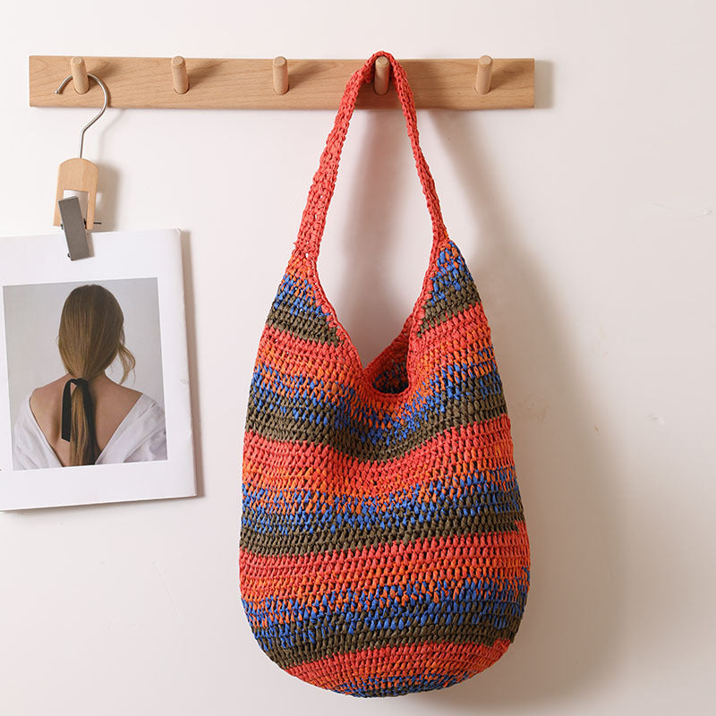Large casual woven straw shoulder bag by Plush Fashion Hub, perfect for seaside vacations and beach outings.