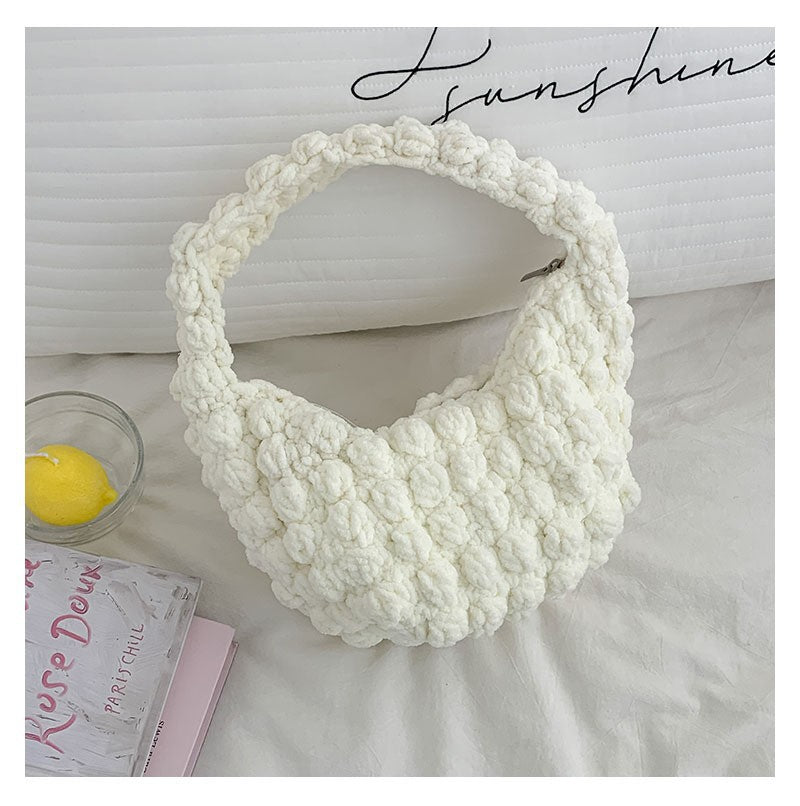 Handmade crocheted solid color straw bag by Bella Mia, portable beanie-style beach bag with hand carry design for seaside vacations