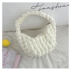 Handmade crocheted solid color straw bag by Bella Mia, portable beanie-style beach bag with hand carry design for seaside vacations