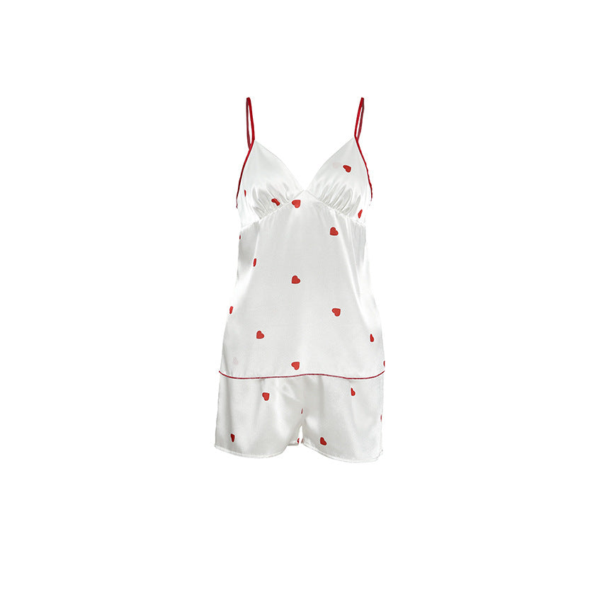 Bella Mia satin spring homewear set featuring heart-print suspender shorts and matching two-piece pajama top for women.