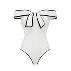 Black and white matching swimsuit for women with a sweet girl bow and white skirt, stylish and comfortable swimwear by Plush Fashion Hub.