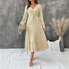 Elegant Bella Mia long sleeve pleated V-neck dress in solid autumn color, featuring a stylish and flowing design.