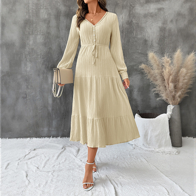 Elegant Bella Mia long sleeve pleated V-neck dress in solid autumn color, featuring a stylish and flowing design.
