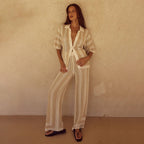 Solid color Bella Mia knitted beach bikini swimsuit with sun blouse, two-piece set, styled for women on a sunny beach.