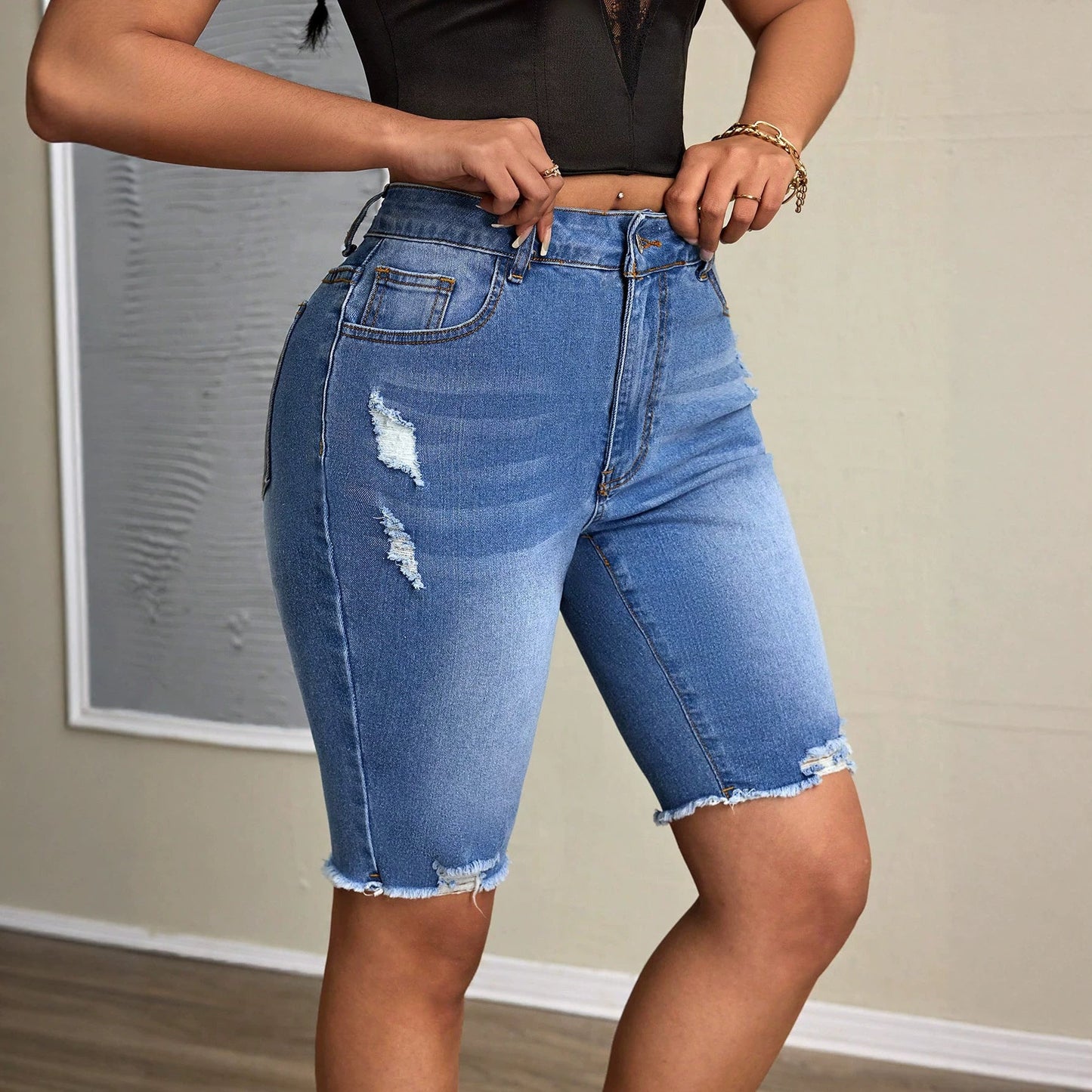 Casual women's denim tight shorts from Plush Fashion Hub featuring classic blue wash and fitted style.