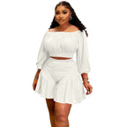 Plus size women's two-piece set by Wanita Store with pleated off-shoulder top and fluffy waist-trimming pants, casual style.