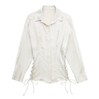 Autumn women’s slim fit satin shirt with long sleeves and lace-up front by Bella Mia, shown in a stylish, close-up view.