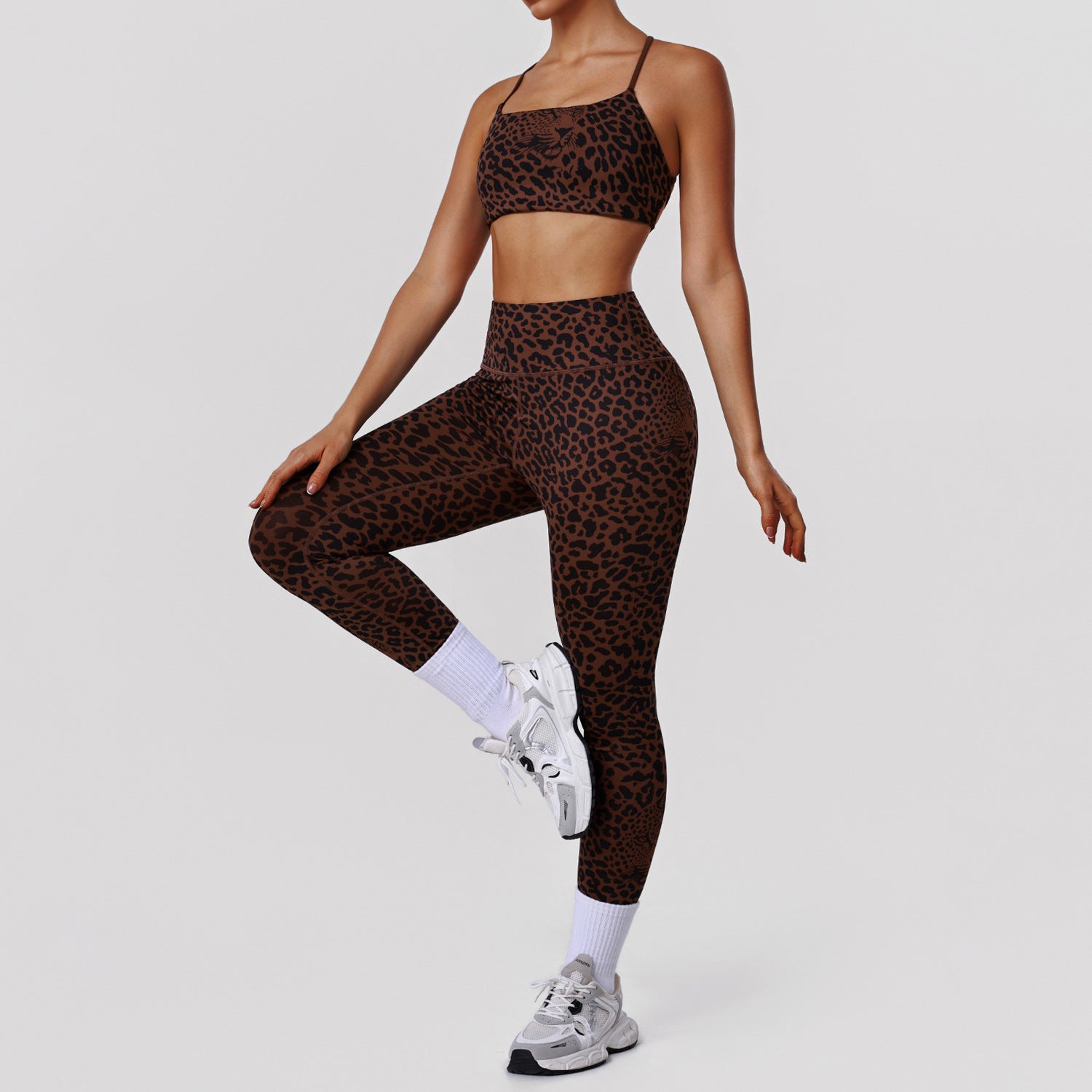 Leopard print high waist yoga pants and matching fitness bra set by Bella Mia, designed for exercise and active wear.