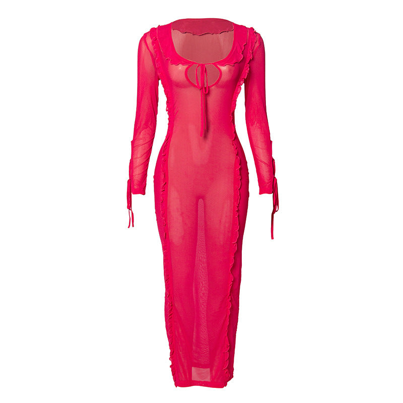 Elegant women’s dress by Wanita Store featuring a solid autumn color, tied design, long wooden earrings, and slim fit style.