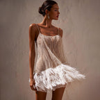 Backless layered tassel mesh sequin cami dress by Plush Fashion Hub, featuring a sexy design with shimmering sequins and stylish details.