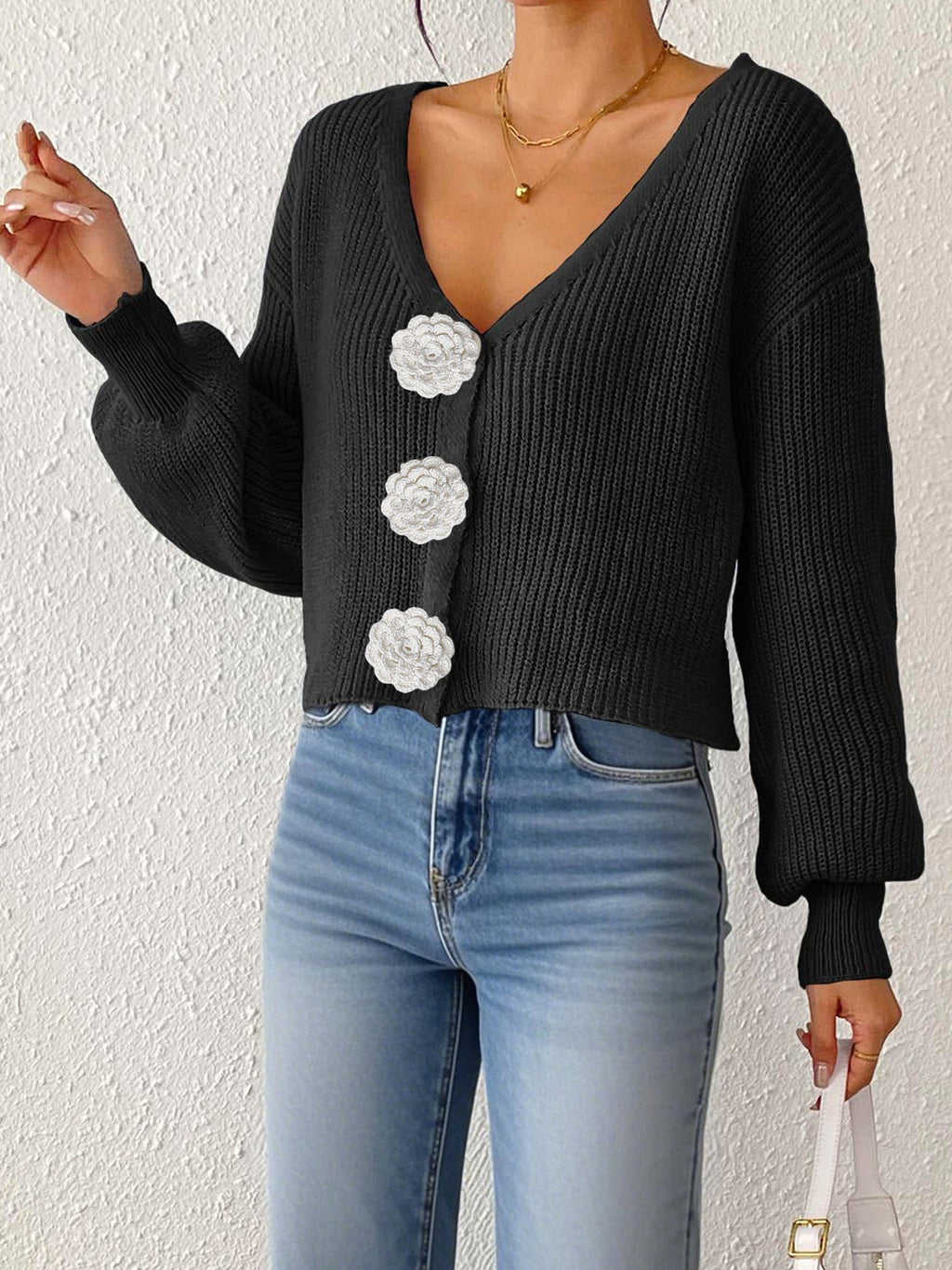 Women’s knitted cardigan by Bella Mia featuring floral buttons, short hipster style, hand hook detail, perfect for casual wear