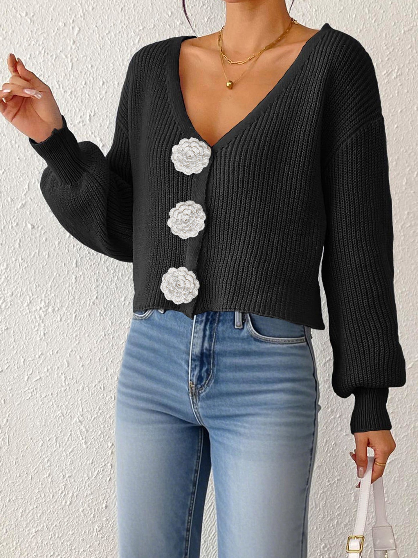 Women’s knitted cardigan by Bella Mia featuring floral buttons, short hipster style, hand hook detail, perfect for casual wear
