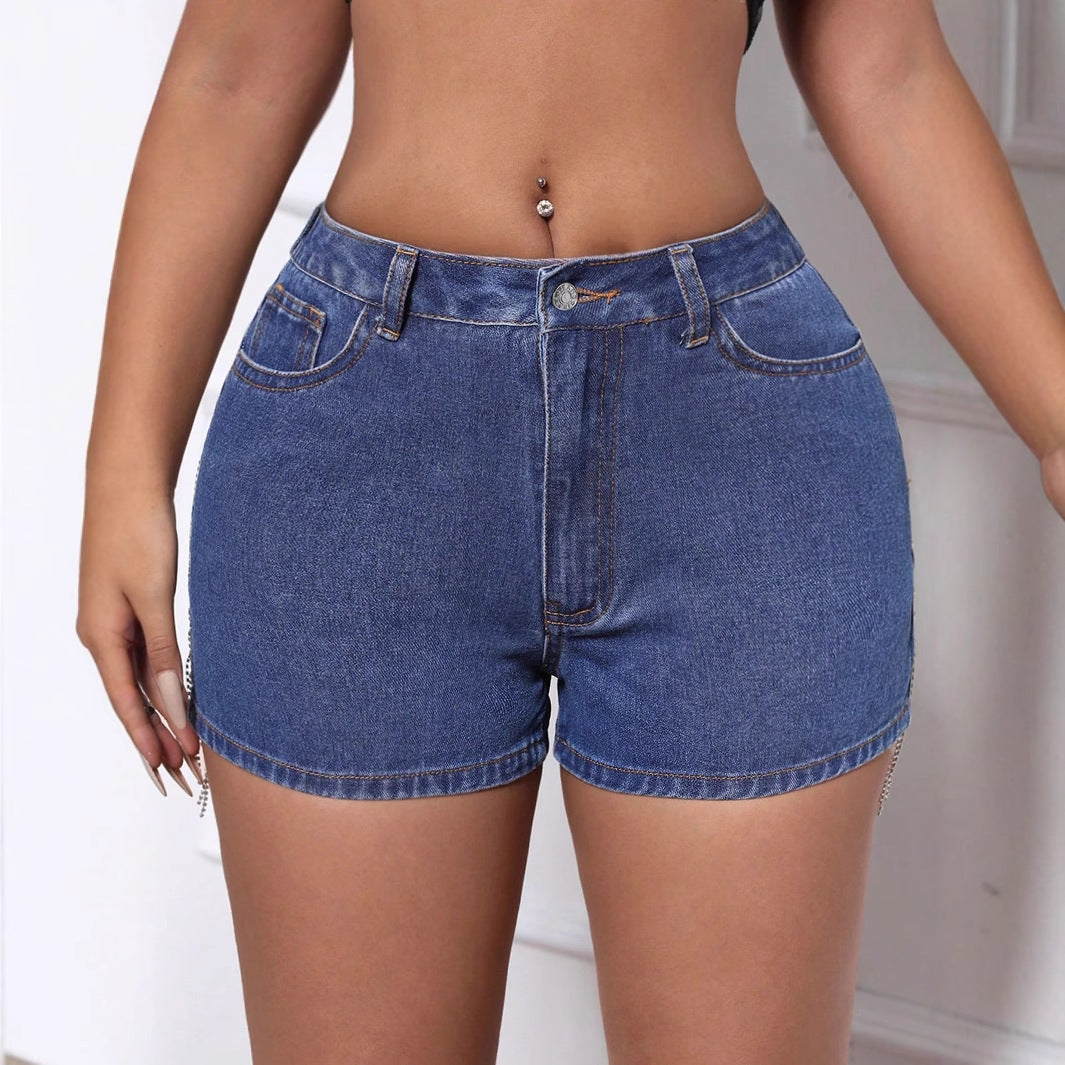 Women’s casual ripped denim shorts with chain and tassel details, stylish and comfortable for everyday wear by Wanita Store