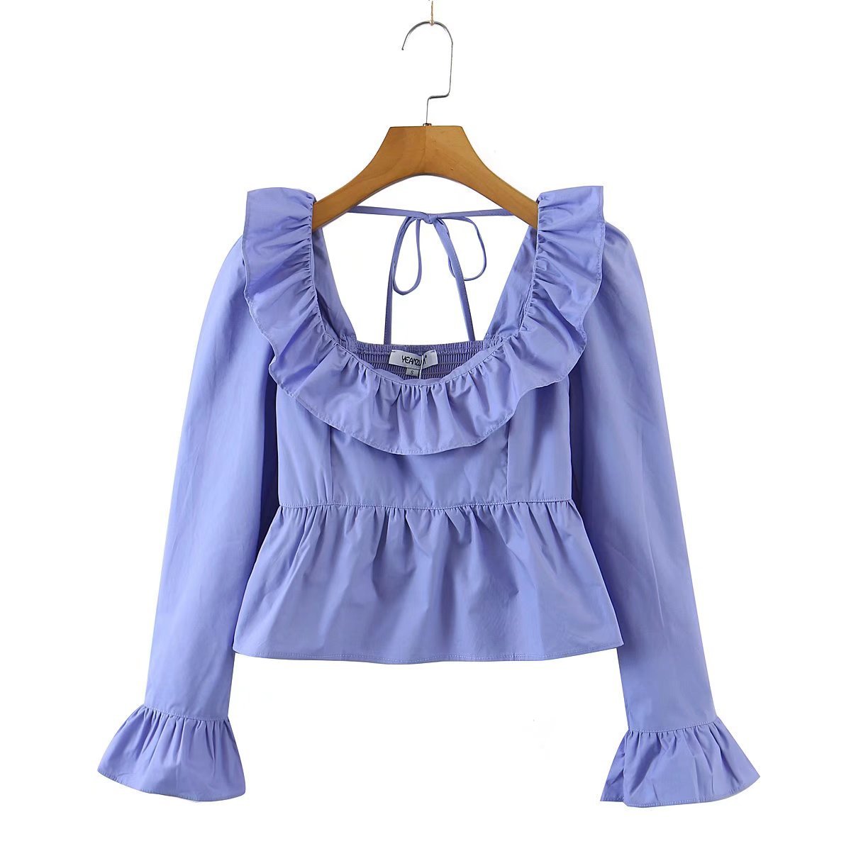 Bella Mia summer wind women solid color long sleeve ruffled shirt displayed on a model with a breezy, stylish look