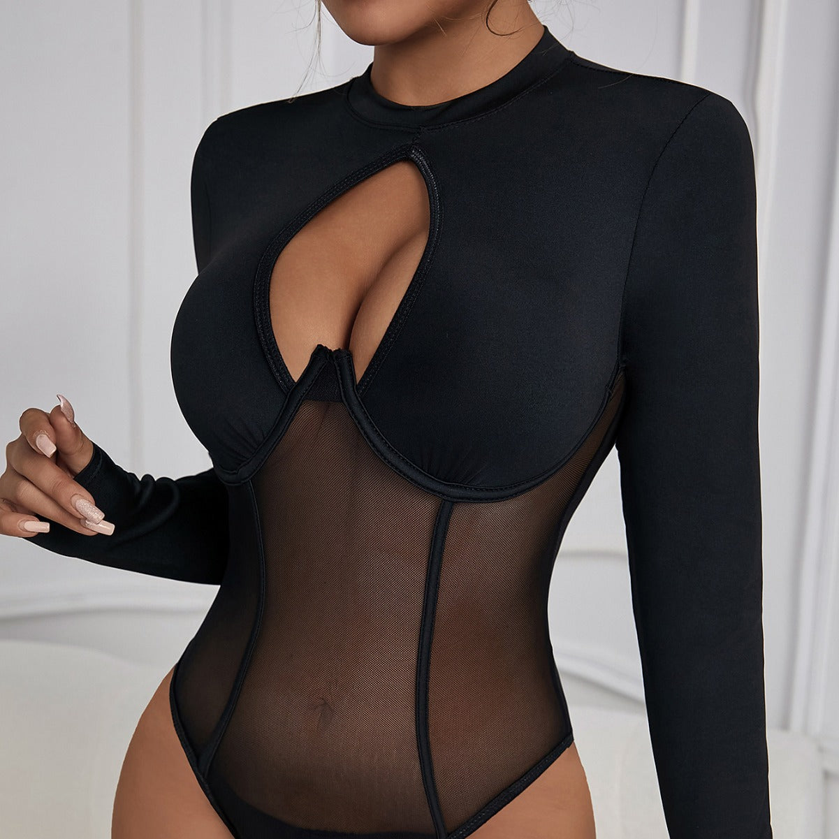 Bella Mia backless mesh jumpsuit with round neck, cutout details, slim fit, and patchwork design, featuring push-up style.