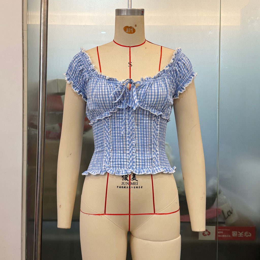 Summer women's plaid top by Plush Fashion Hub with lace edge, puff sleeves, and a short, sweet design.