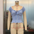 Summer women's plaid top by Plush Fashion Hub with lace edge, puff sleeves, and a short, sweet design.