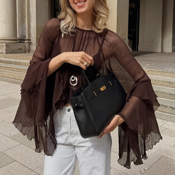 Women’s chiffon shirt with round neck and ruffle sleeves, loose fit, perfect for spring, by Wanita Store.