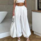 Women’s white high-waist tapered trousers by Wanita Store, casual pleated loose-fit pants with a simple, all-match style.
