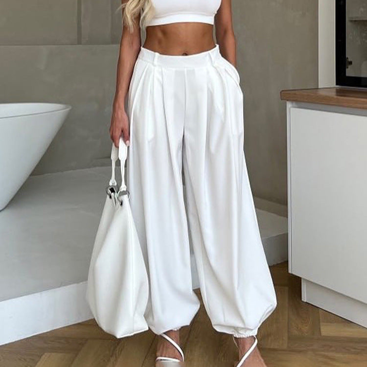 Women’s white high waist tapered trousers by Plush Fashion Hub, casual loose fit pleated pants, perfect for everyday wear.